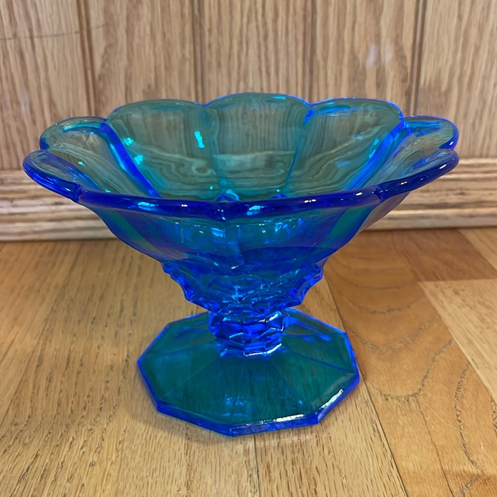 Vintage blue glass pedestal candy dish.